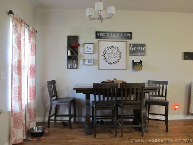 60 S Kaylee Rd, Calera, OK 74730 - dining area featuring baseboards, wood finished floors, and an inviting chandelier