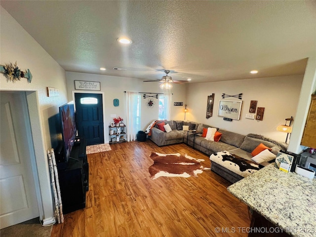 60 S Kaylee Rd, Calera, OK 74730 - living room featuring wood finished floors, a textured ceiling, recessed lighting, and a ceiling fan
