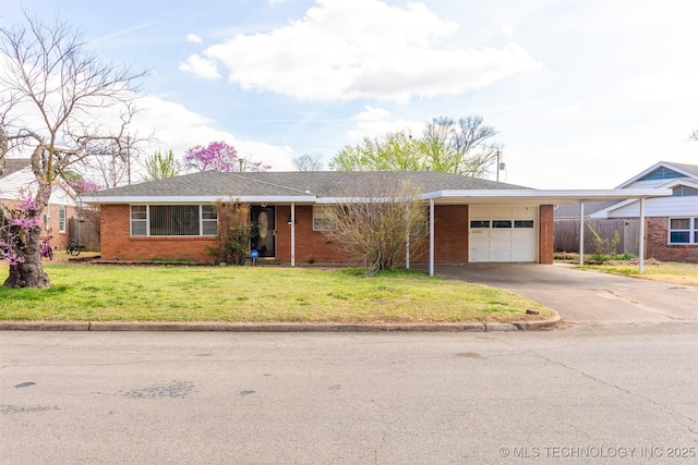 single story home featuring brick siding, a front lawn, a carport, and an attached garage