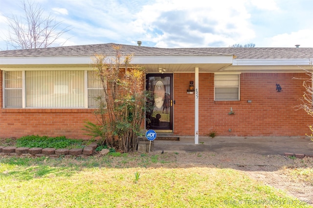 exterior space featuring brick siding