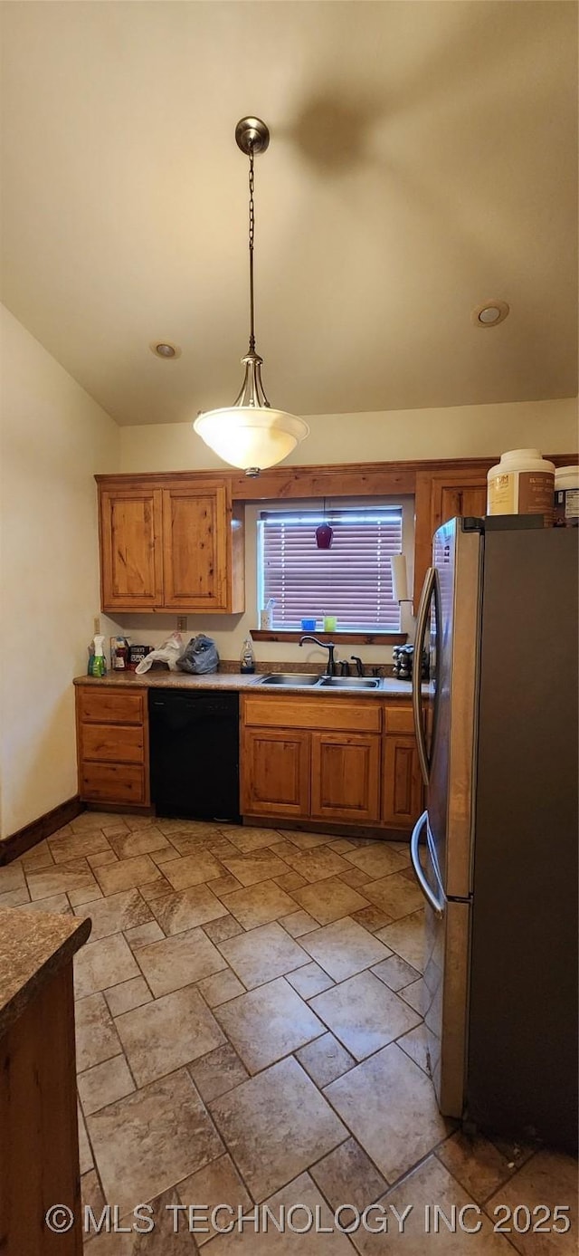 4100 Sally Brown Rd, Muskogee, OK 74403 - kitchen with vaulted ceiling, a sink, brown cabinetry, black dishwasher, and freestanding refrigerator