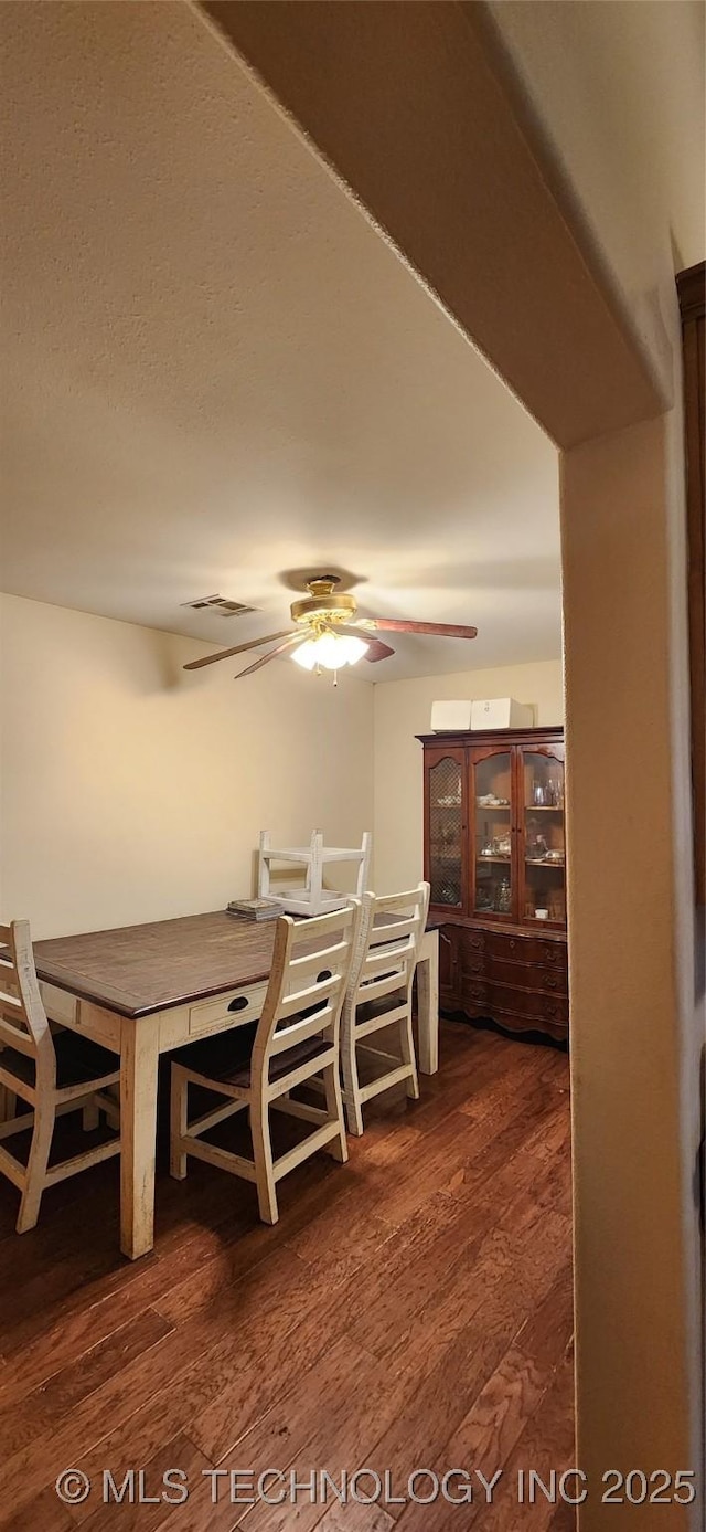 4100 Sally Brown Rd, Muskogee, OK 74403 - dining area featuring dark wood-type flooring and ceiling fan