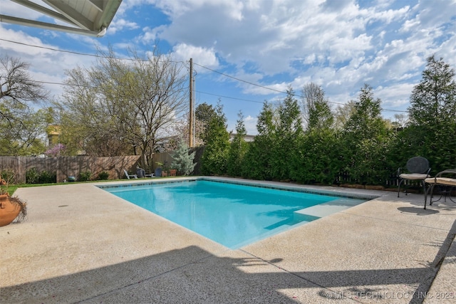 view of pool with a patio, a fenced in pool, and a fenced backyard