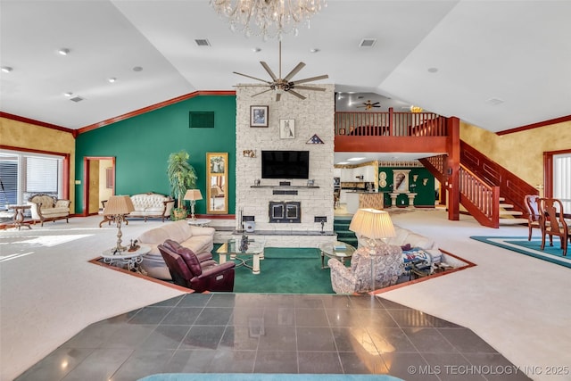 living area with ceiling fan with notable chandelier, vaulted ceiling, and visible vents