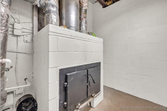 interior details featuring concrete floors and concrete block wall