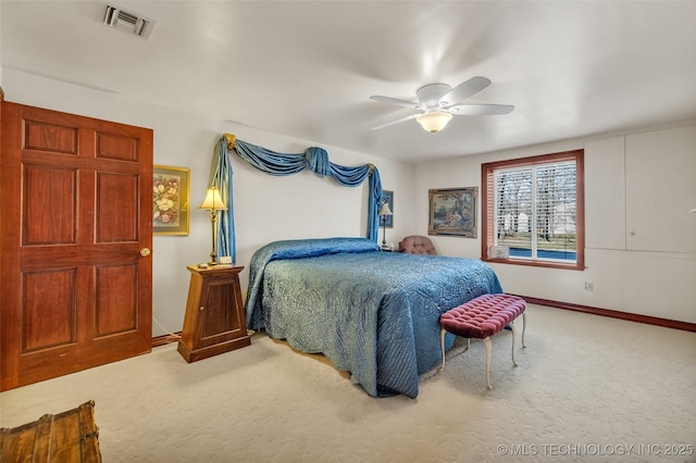 bedroom featuring baseboards, visible vents, ceiling fan, and carpet flooring