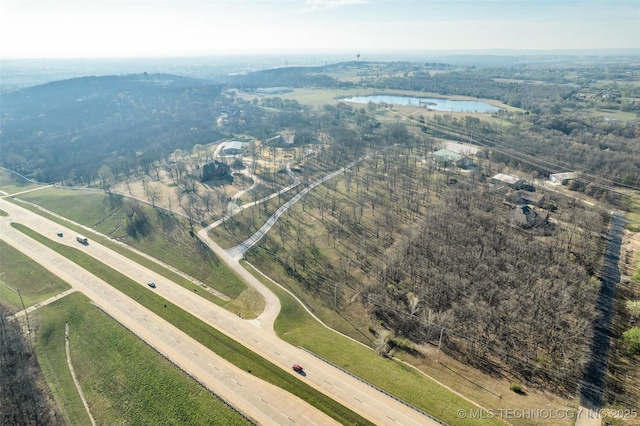 bird's eye view with a water view and a rural view
