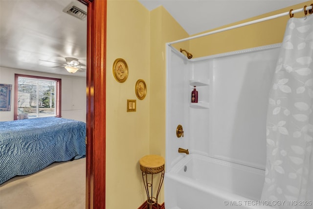 ensuite bathroom featuring shower / tub combo with curtain, connected bathroom, visible vents, and a ceiling fan