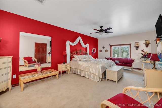 carpeted bedroom featuring a ceiling fan