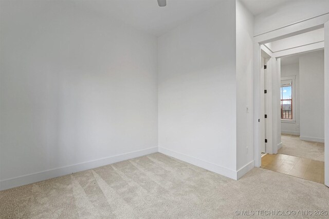 29 Water St Unit 4, Carlton Landing, OK 74432 - spare room with light colored carpet, ceiling fan, and baseboards