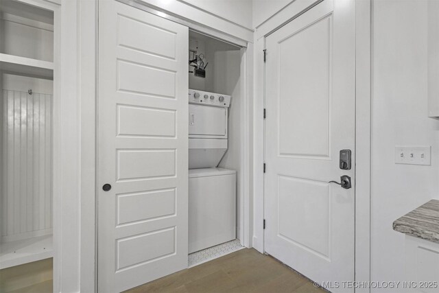 29 Water St Unit 4, Carlton Landing, OK 74432 - laundry room featuring stacked washer and clothes dryer, laundry area, and wood finished floors