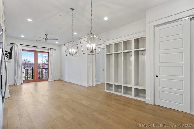29 Water St Unit 4, Carlton Landing, OK 74432 - unfurnished dining area with baseboards, recessed lighting, light wood-type flooring, and ceiling fan with notable chandelier