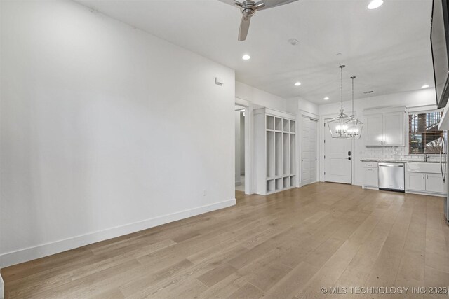 29 Water St Unit 4, Carlton Landing, OK 74432 - unfurnished living room featuring ceiling fan with notable chandelier, light wood-type flooring, recessed lighting, and baseboards