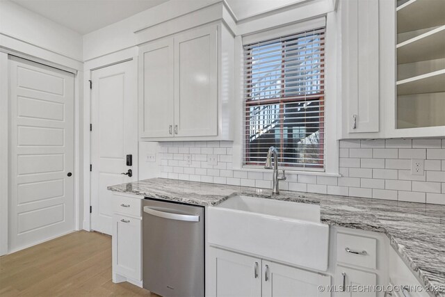 29 Water St Unit 4, Carlton Landing, OK 74432 - kitchen with dishwasher, light wood-style flooring, a sink, and white cabinets