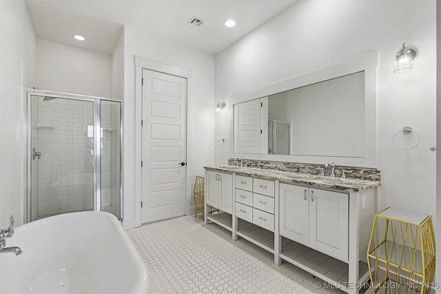 29 Water St Unit 4, Carlton Landing, OK 74432 - bathroom with a shower stall, a sink, visible vents, a freestanding bath, and double vanity