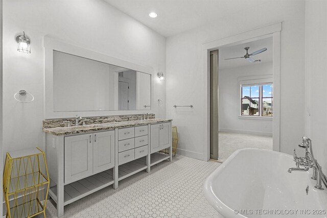 29 Water St Unit 4, Carlton Landing, OK 74432 - bathroom featuring double vanity, a freestanding bath, a sink, and a ceiling fan