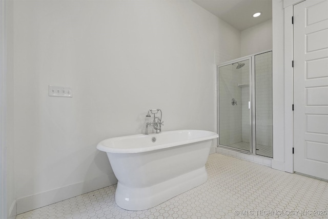 29 Water St Unit 4, Carlton Landing, OK 74432 - bathroom featuring a shower stall, baseboards, and a freestanding bath