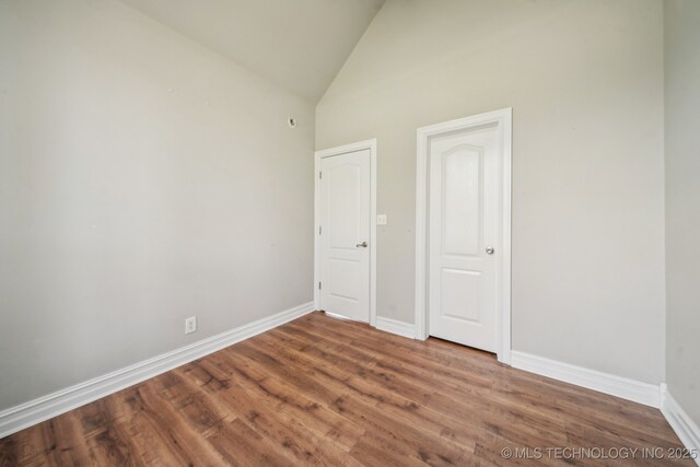 12916 E 181st St S, Bixby, OK 74008 - unfurnished room featuring baseboards, high vaulted ceiling, and wood finished floors