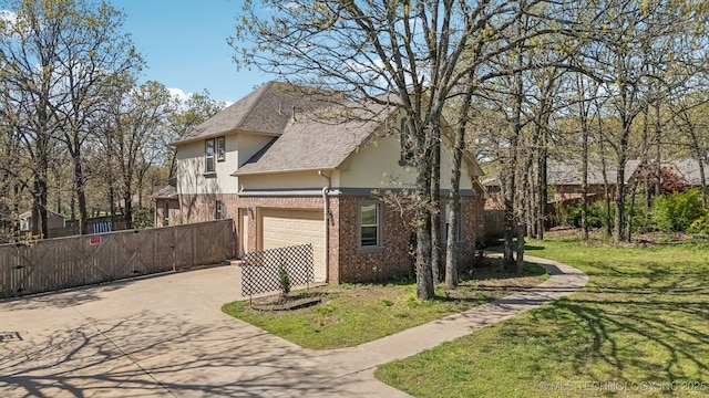 12916 E 181st St S, Bixby, OK 74008 - view of side of property with brick siding, roof with shingles, driveway, and stucco siding