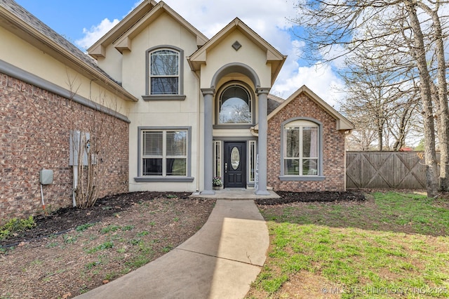 12916 E 181st St S, Bixby, OK 74008 - entrance to property with stucco siding, fence, and brick siding
