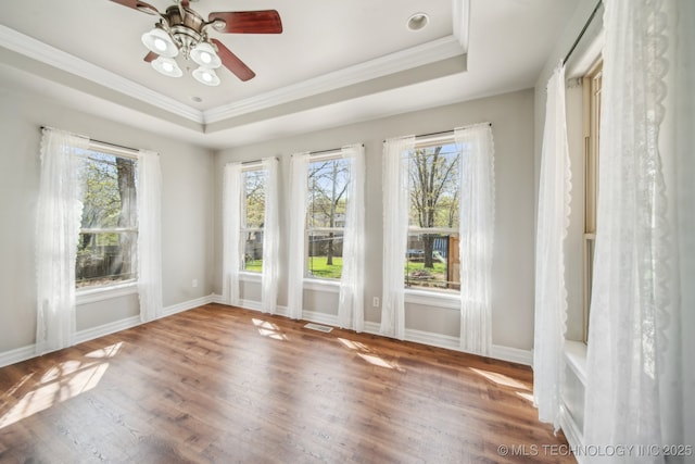 12916 E 181st St S, Bixby, OK 74008 - spare room with a tray ceiling, healthy amount of natural light, wood finished floors, ornamental molding, and a ceiling fan