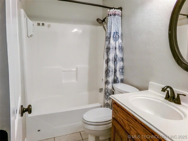 full bathroom with toilet, shower / bath combo with shower curtain, tile patterned floors, and vanity