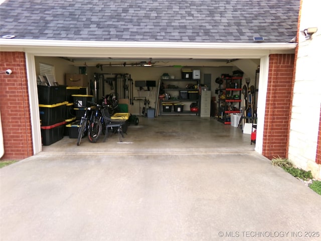 garage with concrete driveway