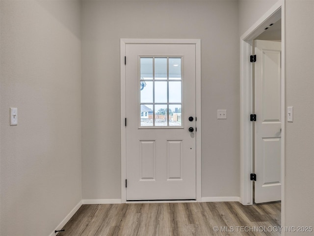 13406 E 124th St, Collinsville, OK 74021 - doorway featuring baseboards and wood finished floors