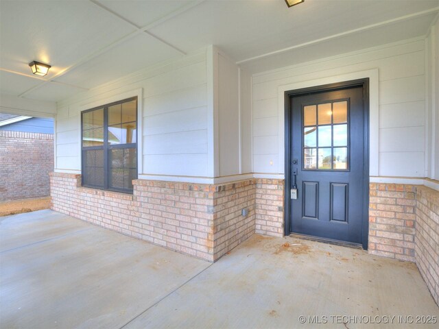 13406 E 124th St, Collinsville, OK 74021 - doorway to property with brick siding