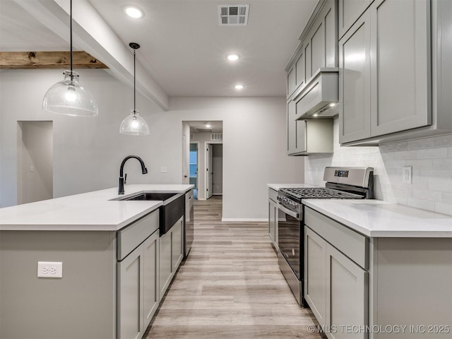 13406 E 124th St, Collinsville, OK 74021 - kitchen with gray cabinetry, visible vents, a sink, and appliances with stainless steel finishes