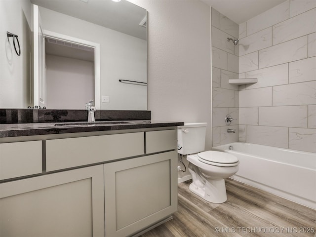13406 E 124th St, Collinsville, OK 74021 - bathroom with toilet, wood finished floors, vanity, and shower / bath combination
