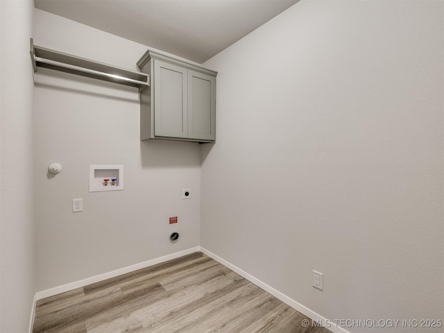 13406 E 124th St, Collinsville, OK 74021 - laundry area featuring baseboards, cabinet space, light wood-style floors, electric dryer hookup, and washer hookup