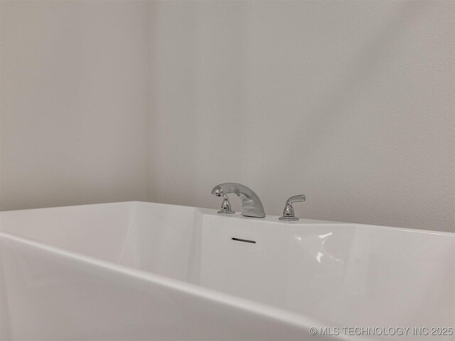 13406 E 124th St, Collinsville, OK 74021 - bathroom featuring a freestanding tub