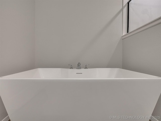 13406 E 124th St, Collinsville, OK 74021 - bathroom featuring a soaking tub