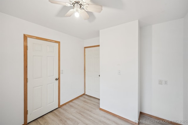 unfurnished bedroom featuring baseboards, light wood finished floors, and ceiling fan