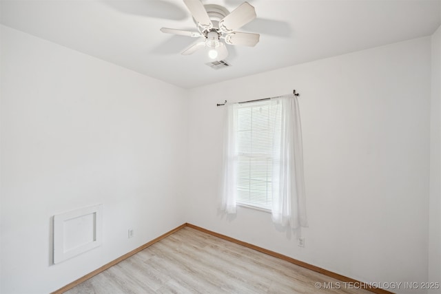 unfurnished room with light wood-type flooring, a wealth of natural light, baseboards, and visible vents