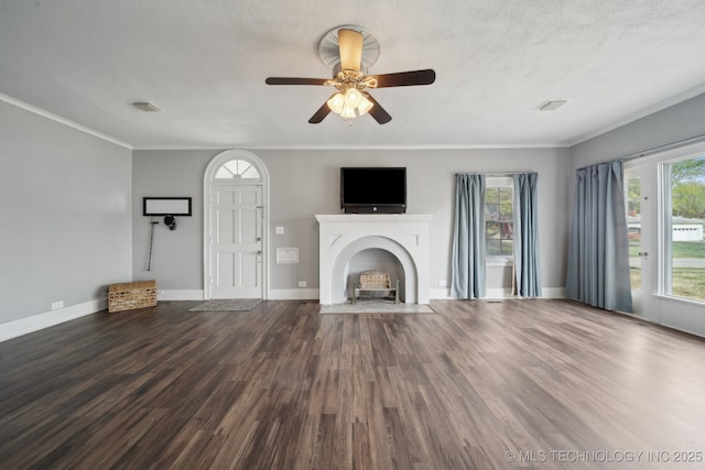 unfurnished living room with visible vents, wood finished floors, and crown molding