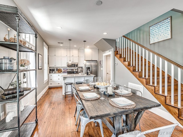 35 Boardwalk St Unit A, Carlton Landing, OK 74432 - dining room with light wood finished floors, stairs, and recessed lighting