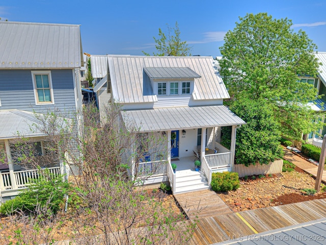 35 Boardwalk St Unit A, Carlton Landing, OK 74432 - view of front of house featuring a porch, a metal roof, and a standing seam roof