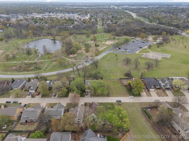 bird's eye view with a residential view and a water view