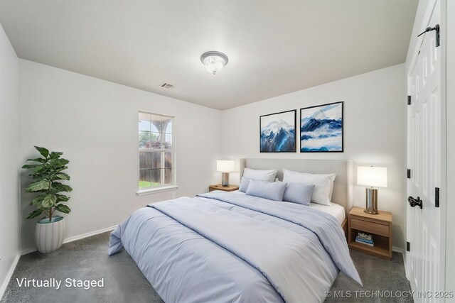 bedroom featuring baseboards, carpet, visible vents, and a closet