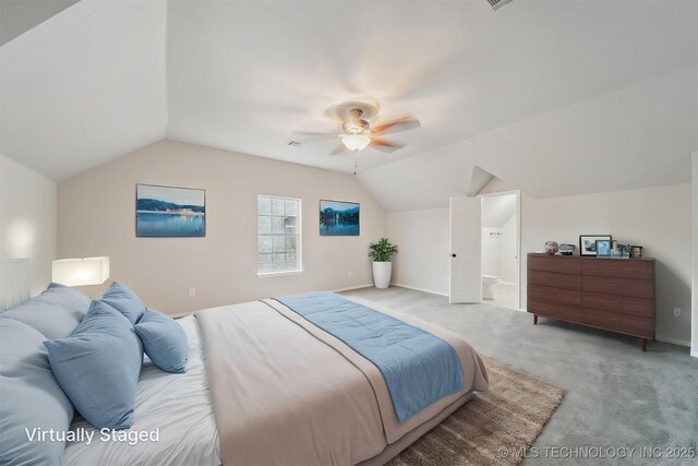 bedroom featuring baseboards, ceiling fan, vaulted ceiling, and light colored carpet