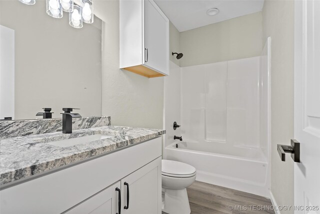 809 H NW, Ardmore, OK 73401 - bathroom with vanity, wood finished floors, and bathing tub / shower combination