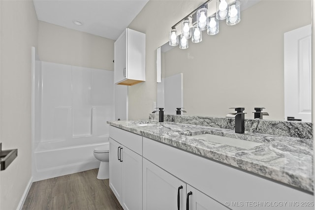 809 H NW, Ardmore, OK 73401 - full bath with double vanity, wood finished floors, and  shower combination