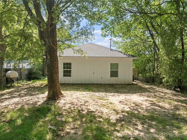 809 H NW, Ardmore, OK 73401 - rear view of property featuring board and batten siding and roof with shingles