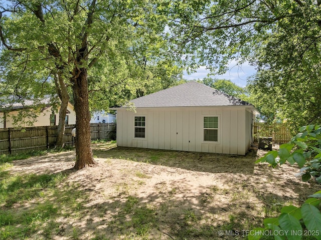 809 H NW, Ardmore, OK 73401 - rear view of property with a fenced backyard, a shingled roof, and board and batten siding