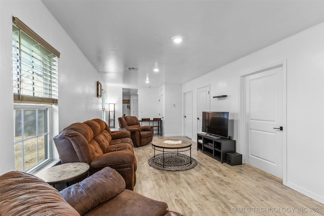 900 S Johnston, Ada, OK 74820 - living room featuring light wood-style floors, healthy amount of natural light, baseboards, and recessed lighting
