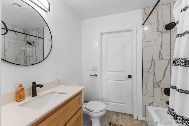 900 S Johnston, Ada, OK 74820 - full bath featuring toilet, vanity, wood finished floors, and shower / tub combo with curtain
