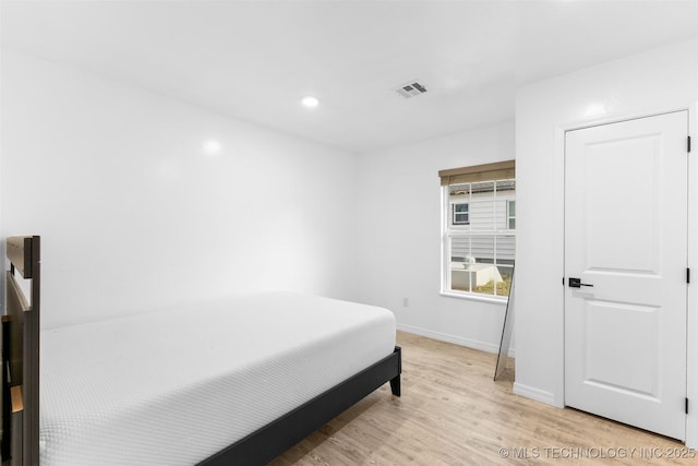 900 S Johnston, Ada, OK 74820 - bedroom featuring light wood-style flooring, baseboards, and recessed lighting