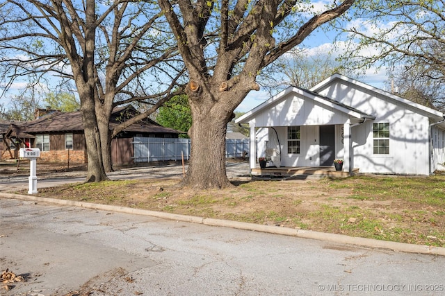 900 S Johnston, Ada, OK 74820 - view of front of house featuring covered porch, a carport, and driveway